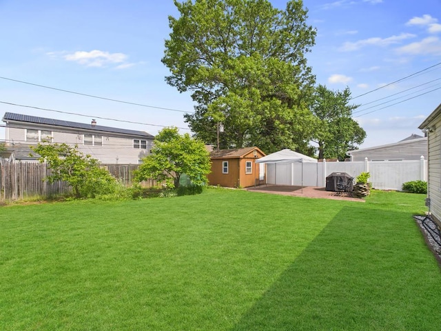 335 Loring Rd, Levittown, NY 11756 - fenced backyard with a patio and a shed