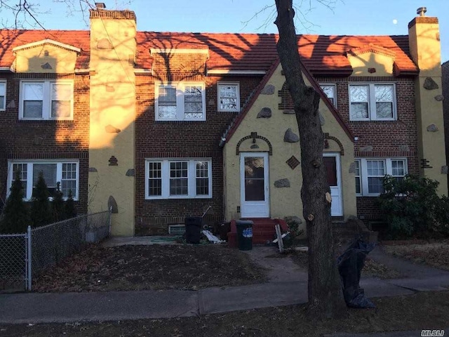 47-09 188th St, Flushing, NY 11358 - view of front of property with brick siding, entry steps, and a chimney