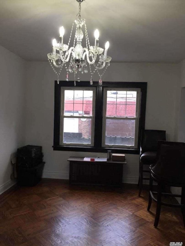 47-09 188th St, Flushing, NY 11358 - dining space with a chandelier and baseboards