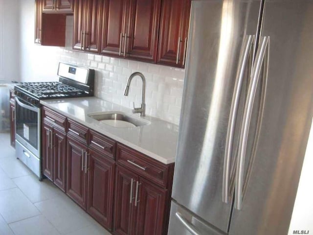 47-09 188th St, Flushing, NY 11358 - kitchen featuring appliances with stainless steel finishes, a sink, backsplash, and light countertops