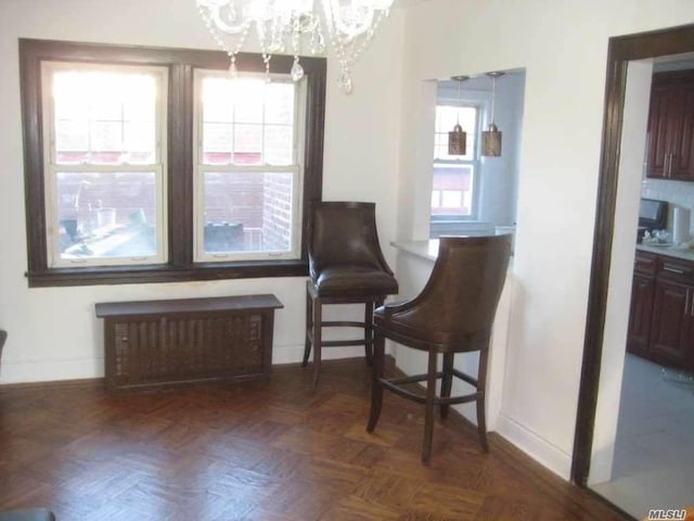 47-09 188th St, Flushing, NY 11358 - sitting room with a chandelier, baseboards, radiator heating unit, and healthy amount of natural light