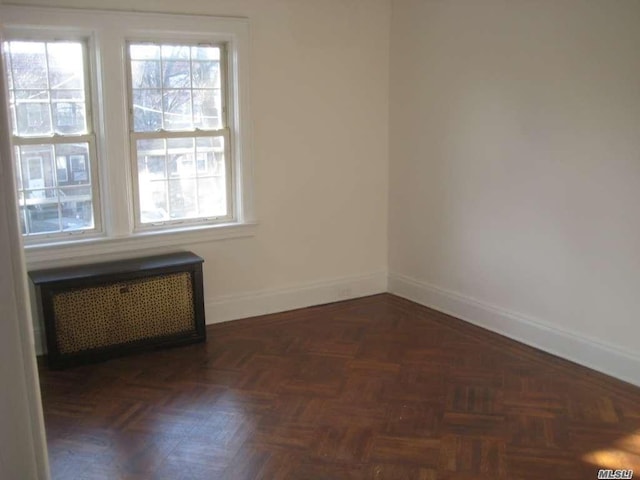 47-09 188th St, Flushing, NY 11358 - unfurnished room with radiator heating unit and baseboards