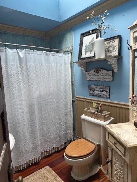 268 Windsor Ave, Brightwaters, NY 11718 - bathroom with a wainscoted wall, wood finished floors, vanity, and a shower with curtain