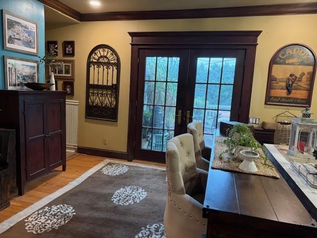 268 Windsor Ave, Brightwaters, NY 11718 - entryway featuring light wood-style floors, french doors, ornamental molding, and radiator heating unit