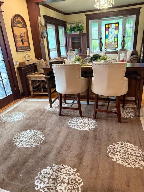 268 Windsor Ave, Brightwaters, NY 11718 - dining area featuring wood finished floors, ornamental molding, and plenty of natural light
