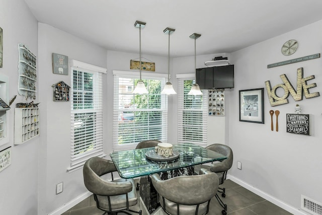 147 The Knl, Syosset, NY 11791 - dining space with dark tile patterned floors and baseboards