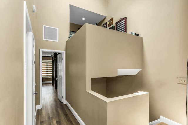 147 The Knl, Syosset, NY 11791 - corridor featuring baseboards and dark wood-style floors