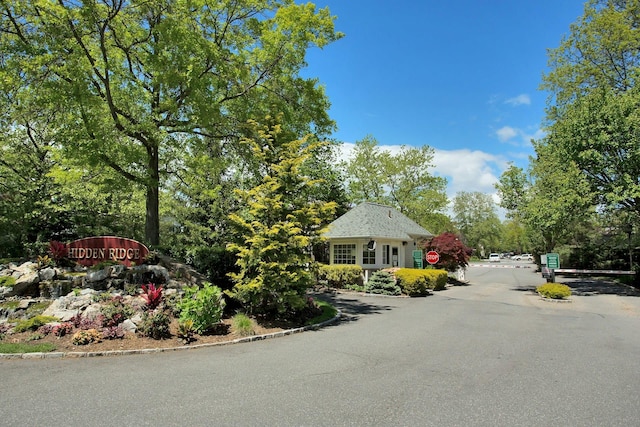 147 The Knl, Syosset, NY 11791 - view of asphalt street with curbs and traffic signs