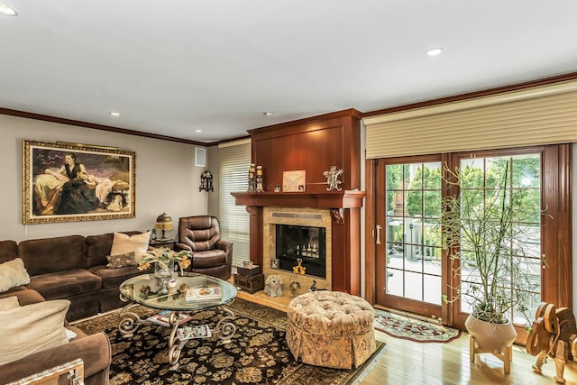 147 The Knl, Syosset, NY 11791 - living room with light wood-style flooring, ornamental molding, a high end fireplace, and recessed lighting