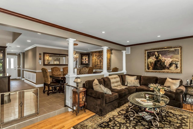 147 The Knl, Syosset, NY 11791 - living room featuring decorative columns, recessed lighting, ornamental molding, and wood finished floors