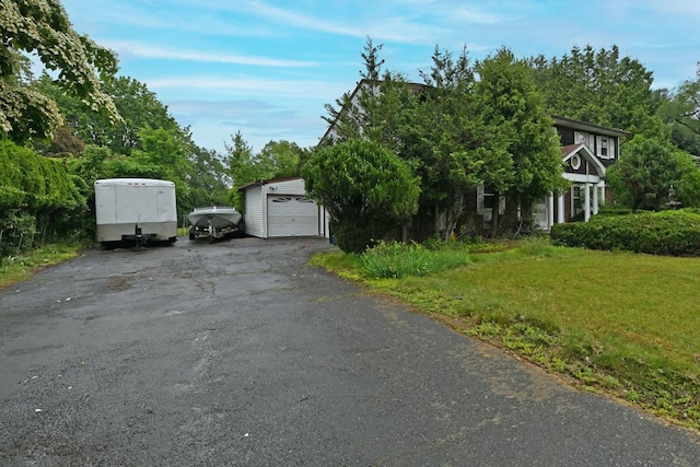 8 Macintosh Ln, Monsey, NY 10952 - view of front of home with a garage, a front yard, and driveway