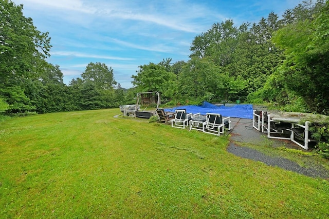8 Macintosh Ln, Monsey, NY 10952 - view of green lawn with a covered pool