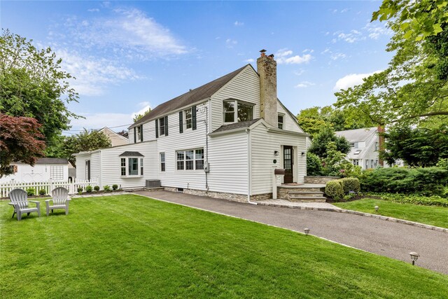 182 Carlton Ter, Stewart Manor, NY 11530 - back of house with a chimney