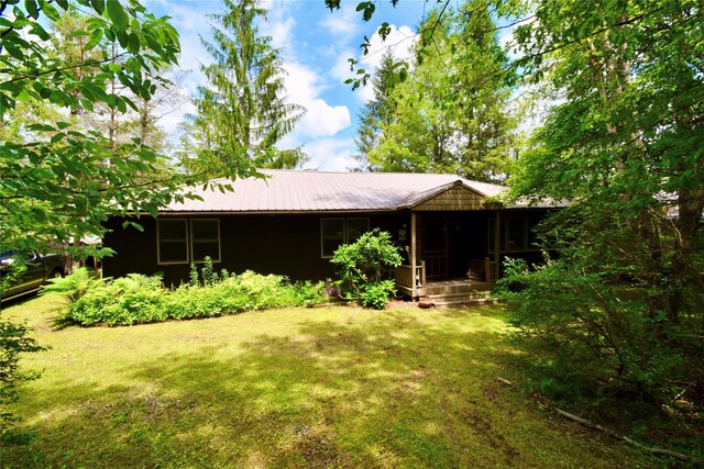 240 Trout Brook Rd, Roscoe, NY 12736 - back of property featuring a lawn, a metal roof, and a porch