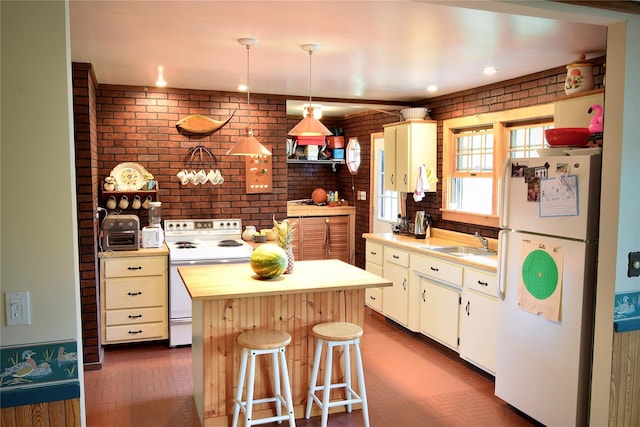 240 Trout Brook Rd, Roscoe, NY 12736 - kitchen featuring white appliances, light countertops, a kitchen island, brick wall, and white cabinetry