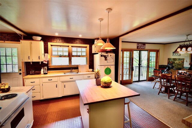 240 Trout Brook Rd, Roscoe, NY 12736 - kitchen featuring white appliances, wooden counters, brick patterned flooring, and healthy amount of natural light