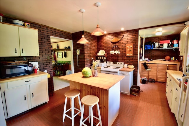 240 Trout Brook Rd, Roscoe, NY 12736 - kitchen with black microwave, white range with electric cooktop, brick wall, butcher block countertops, and white cabinets