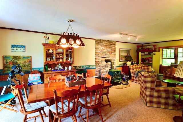 240 Trout Brook Rd, Roscoe, NY 12736 - dining area featuring crown molding, carpet, track lighting, and a wood stove