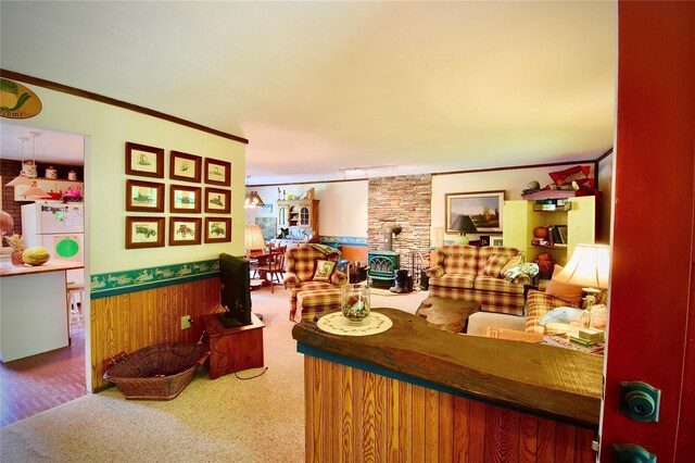 240 Trout Brook Rd, Roscoe, NY 12736 - carpeted living area with a wood stove, crown molding, a wainscoted wall, and wooden walls