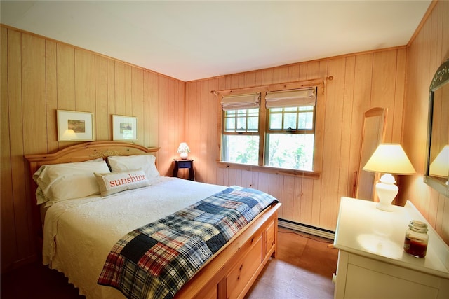 240 Trout Brook Rd, Roscoe, NY 12736 - bedroom featuring wooden walls, baseboard heating, and wood finished floors