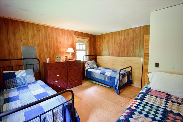 240 Trout Brook Rd, Roscoe, NY 12736 - bedroom featuring wooden walls and light wood-style flooring