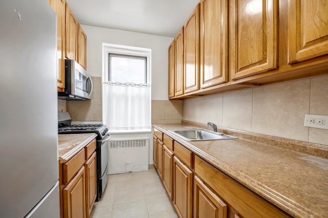 6360 102nd St Unit D8, Rego Park, NY 11374 - kitchen featuring stainless steel appliances, a sink, tasteful backsplash, light countertops, and light tile patterned flooring