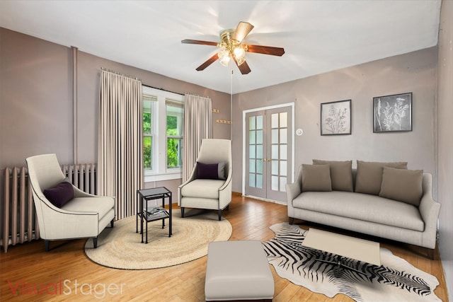 334 Union Ave, Peekskill, NY 10566 - living room featuring hardwood / wood-style floors, ceiling fan, radiator, and french doors