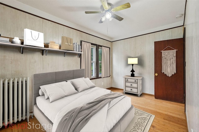 334 Union Ave, Peekskill, NY 10566 - bedroom with radiator, wood finished floors, and ceiling fan