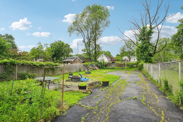 334 Union Ave, Peekskill, NY 10566 - view of yard with a playground and an outdoor fire pit