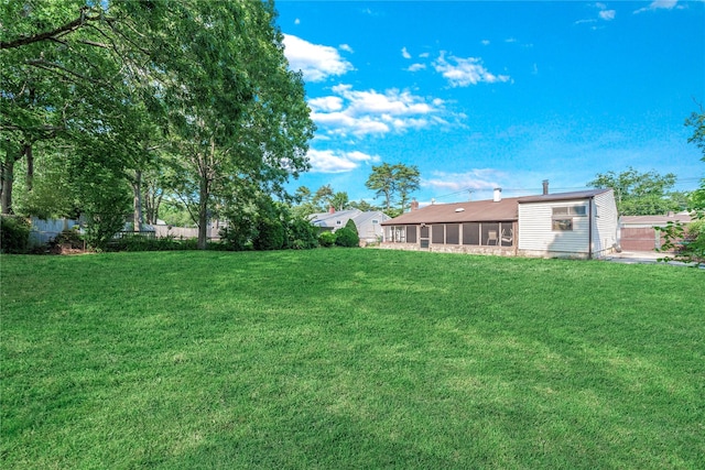 168 Gibbs Rd, Central Islip, NY 11722 - view of yard featuring a sunroom