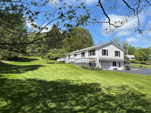 105 White Sulphur Rd, Swan Lake, NY 12783 - rear view of property with an attached garage, a yard, asphalt driveway, and stairway