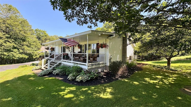 105 White Sulphur Rd, Swan Lake, NY 12783 - view of front of property featuring covered porch and a front lawn