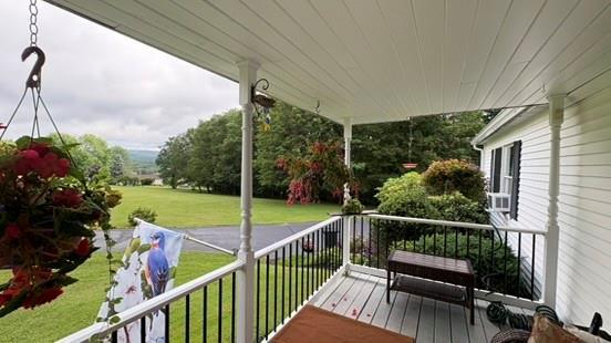 105 White Sulphur Rd, Swan Lake, NY 12783 - wooden deck featuring a lawn