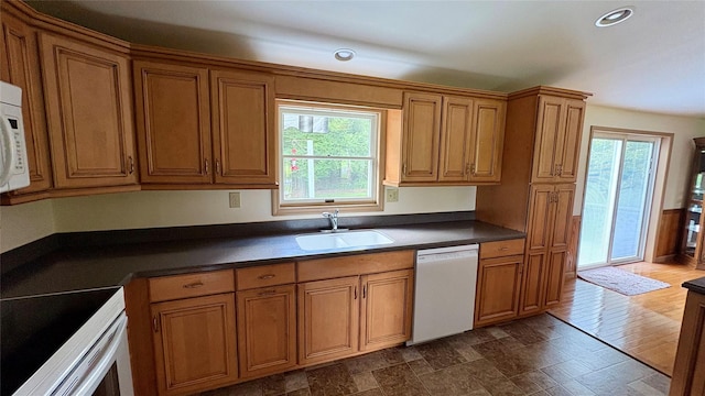 105 White Sulphur Rd, Swan Lake, NY 12783 - kitchen featuring white appliances, brown cabinets, dark countertops, and recessed lighting