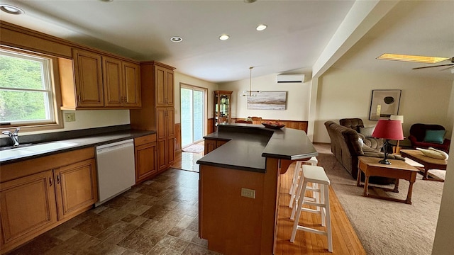105 White Sulphur Rd, Swan Lake, NY 12783 - kitchen with white dishwasher, dark countertops, lofted ceiling, a kitchen bar, and open floor plan