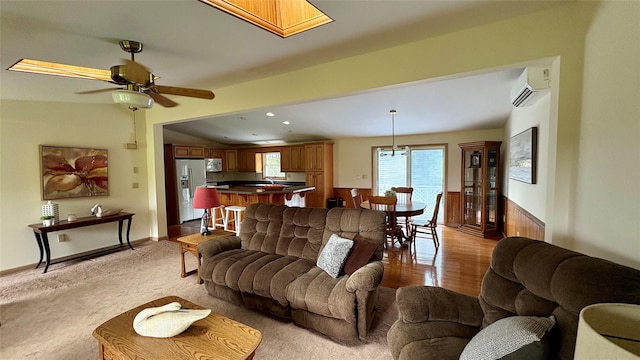 105 White Sulphur Rd, Swan Lake, NY 12783 - living room with a wall mounted air conditioner, ceiling fan, light wood-style flooring, a wainscoted wall, and recessed lighting