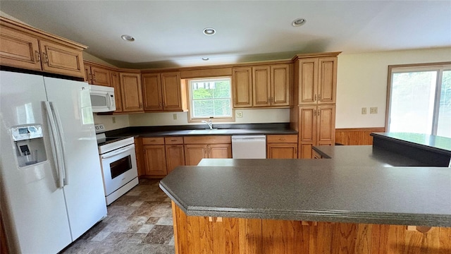 105 White Sulphur Rd, Swan Lake, NY 12783 - kitchen with white appliances, dark countertops, plenty of natural light, stone finish floors, and recessed lighting