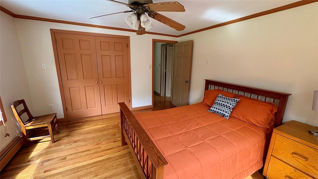 105 White Sulphur Rd, Swan Lake, NY 12783 - bedroom with baseboard heating, light wood finished floors, ornamental molding, a closet, and a ceiling fan