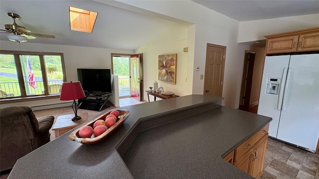 105 White Sulphur Rd, Swan Lake, NY 12783 - kitchen with white refrigerator with ice dispenser, dark countertops, ceiling fan, open floor plan, and lofted ceiling