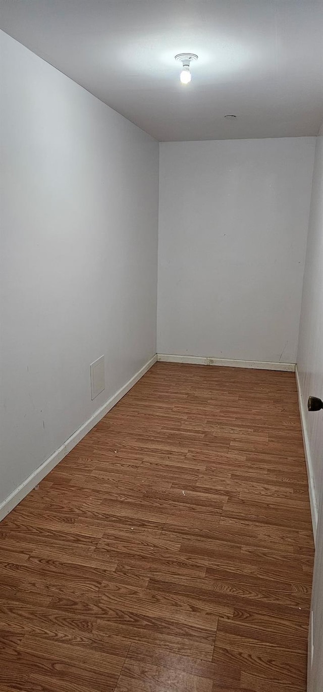 108-31 50th Ave Unit 1, Corona, NY 11368 - spare room with wood finished floors and baseboards