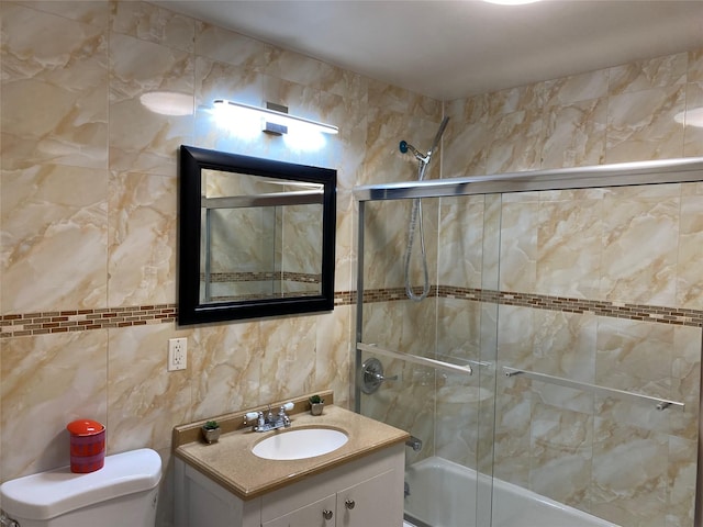 108-31 50th Ave Unit 1, Corona, NY 11368 - bathroom featuring shower / bath combination with glass door, toilet, vanity, tile walls, and decorative backsplash
