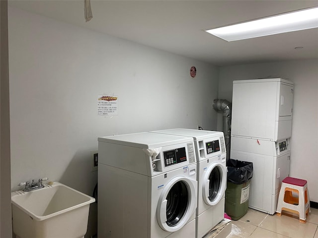 108-31 50th Ave Unit 1, Corona, NY 11368 - shared laundry with washing machine and dryer, estacked washer and dryer, and light tile patterned floors