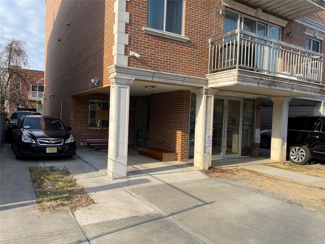 108-31 50th Ave Unit 1, Corona, NY 11368 - property entrance with brick siding and a balcony
