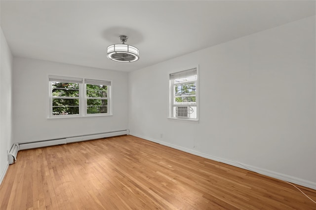4 Leewood Cir Unit 3R, Eastchester, NY 10709 - unfurnished room featuring baseboard heating, light wood-style flooring, and cooling unit