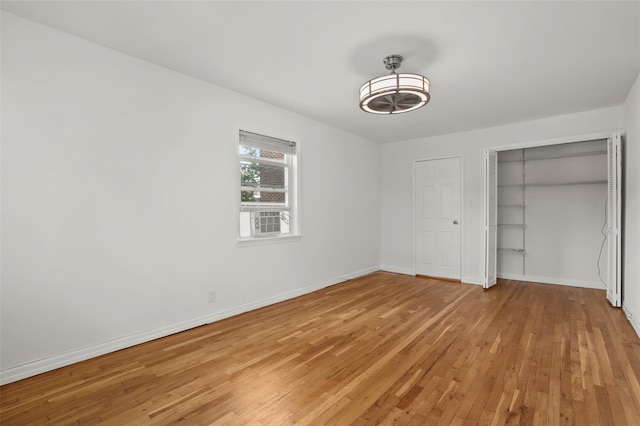 4 Leewood Cir Unit 3R, Eastchester, NY 10709 - unfurnished bedroom featuring light wood-style floors, a closet, and cooling unit