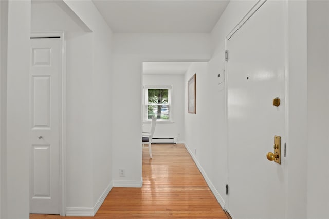 4 Leewood Cir Unit 3R, Eastchester, NY 10709 - hallway with light wood-style floors and a baseboard radiator