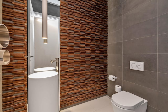 1555 Stevenson Rd, Hewlett, NY 11557 - bathroom with tile walls and tile patterned flooring
