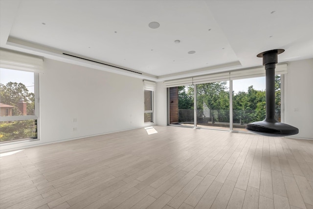 1555 Stevenson Rd, Hewlett, NY 11557 - unfurnished room featuring a tray ceiling, healthy amount of natural light, and light wood finished floors