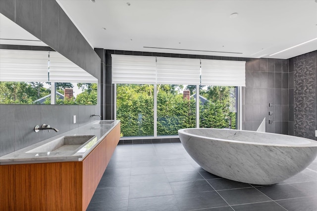 1555 Stevenson Rd, Hewlett, NY 11557 - full bath featuring a freestanding tub, tile patterned flooring, and double vanity