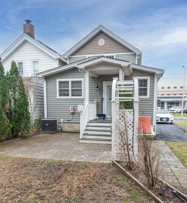 163 N Hamilton St, Poughkeepsie, NY 12601 - shotgun-style home with central AC and a chimney